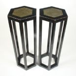 A pair of Chinese black lacquered hexagonal section stands, the top of each with a green,