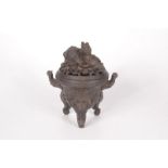 A Chinese bronze censer, 19th century, with gilt highlights,