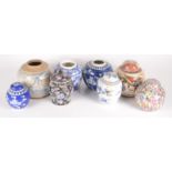 Eight Chinese ginger jars, including a blue and white prunus pattern jar, height 12.5cm, width 12cm.