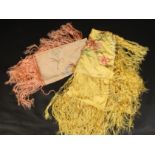 A yellow silk floral embroidered fringed shawl, 1920s, 103 x 90cm and a similar pink silk shawl,