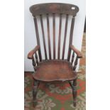 A Victorian lathe back armchair, with solid arms, back and seat on turned legs, height 115cm.