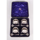 A set of four silver Georgian style open salts with gadrooned boarders, London 1905. 6.2oz.