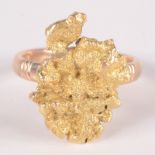 A 14ct gold ring mounted with a gold nugget, 8.8g.
