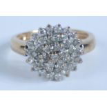 A 9ct gold diamond target cluster ring.