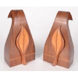 A pair of Modernist rosewood bookends, with satinwood leaf decoration,