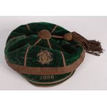 A green velvet and metal thread 1888 sports cap, with monogram, by W. Laird.