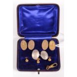 A pair of 15ct gold monogrammed cuff-links and three 15ct gold studs, cased. 9.