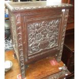 A carved oak music cabinet, early 20th century,