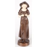 A bronze and ivory figure of a girl selling, after Peter Pereszczuk, signed, height 32cm.