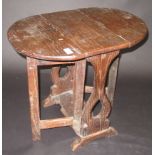 A small oak twin flap table in 17th century style.