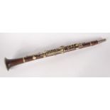 A clarinet, indistinct impressed mark, length 65cm.
