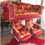A Victorian red velvet, floral decorated upholstered three piece suite, the sofa with reclining arm,