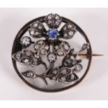 A late 19th century French high purity gold brooch with a rose diamond and sapphire silver set