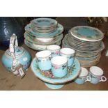 A late Victorian part dinner service, the blue ground with floral and butterfly decoration,