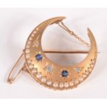 A late Victorian matte high purity gold crescent brooch set three diamonds and two sapphires