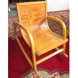 A Bentwood child's rocking chair, height 43.5cm, width 34cm, depth 56.5cm.