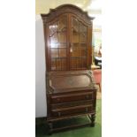 A carved oak secretaire bureau bookcase, early 20th century,