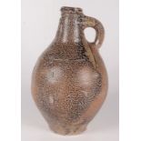 A tiger salt glazed stoneware bellarmine jug, 17th century,