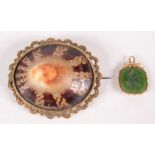 A high purity gold mounted carved green stone intaglio fob,