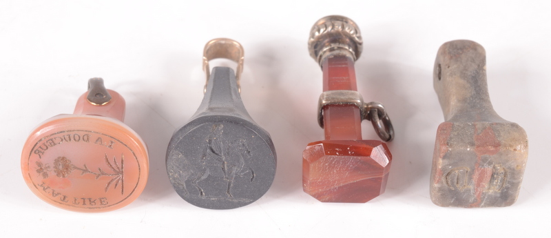 An 18th century basalt seal and three other small stone seals.