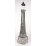 A serpentine table lamp, modelled as a lighthouse, height 57.5cm, diameter of base 16.5cm.