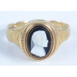 An early Victorian engraved gold mourning ring with a hardstone cameo carved with a bust of Dante