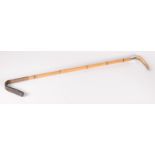 A bamboo riding crop,