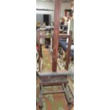 A Victorian oak adjustable artist's easel, with winding mechanism, height 213cm, width 63cm,