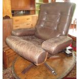 A stylish post-war brown leather and laminated teak swivel chair with buttoned upholstery and low