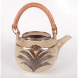 A David Leach, Lowerdown Pottery stoneware teapot, of squat form with bamboo handle,