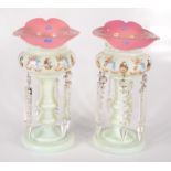 A pair of Victorian pink and milk glass lustres, each with floral painted and gilt decoration,