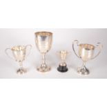 Four silver trophy cups, 14oz.