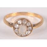 An 18ct gold ring set with a cluster of rose cut diamonds.