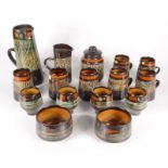 A selection of Celtic Pottery to include, a large jug, height 26cm, seven mugs, height 12cm,