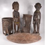 Two African carved wood fertility figures of a naked man and woman, heights 65cm and 66cm,