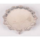 A late Victorian silver card tray in mid 18th century style,
