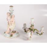A German porcelain candelabrum, early 20th century, the stem modelled as a seated lady and child,
