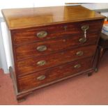 A George III mahogany chest of drawers, the large deep drawer fronted by two dummy drawers,