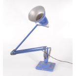 A blue anglepoise lamp, inscribed 'Made in England by Herbert Terry & Sons, Redditch'.