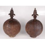 A pair of cast iron garden finials, height 35cm, diameter 19cm.