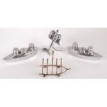 Three chromium plated cruets, one in the form of an aeroplane, the others ocean liners,