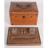 A satin birch work box, 19th century, surmounted by a brass handle, height 15.5cm, width 23.