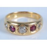 An 18ct gold ring gypsy set with three diamonds and two rubies, 8g.