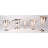 A Mappin & Webb silver cup, together with four other silver cups, 35.6oz.