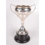 An Okehampton Show twin handled silver trophy, 9.7oz, maximum height including ebonised base 30.5cm.