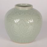 A Chinese celadon glaze ginger jar, seal base to base, height 13.5cm, diameter 15cm.