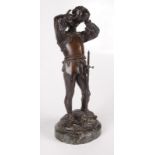 A bronze figure of a swordsman, 19th century, drinking from his helmet, on an oval marble base,