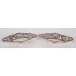 A pair of small Victorian pierced embossed silver sweetmeat baskets, London 1894, 1.5oz.