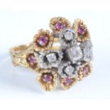 A heavy 18ct gold post war ring, set with a naturalistic cluster of diamonds and rubies, 12.6g.