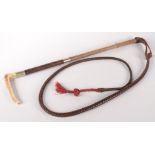 A brown leather and antler handled riding whip, length 187cm.